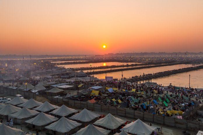Hindu pilgrims cross pontoon bridges into the massive campsite during the festival of Kumbha Mela on February 10th 2013 at Allahabad, India. Kumbh Mela: The Greatest Celebration on Earth