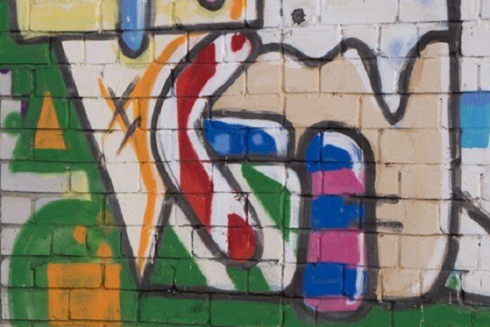 Beautiful street art of graffiti. Abstract color creative drawing fashion on walls of city. Urban contemporary culture. Title paint on walls. Culture youth protest. ABSTRACT PICTURE . Conflicting Dimensions of Life